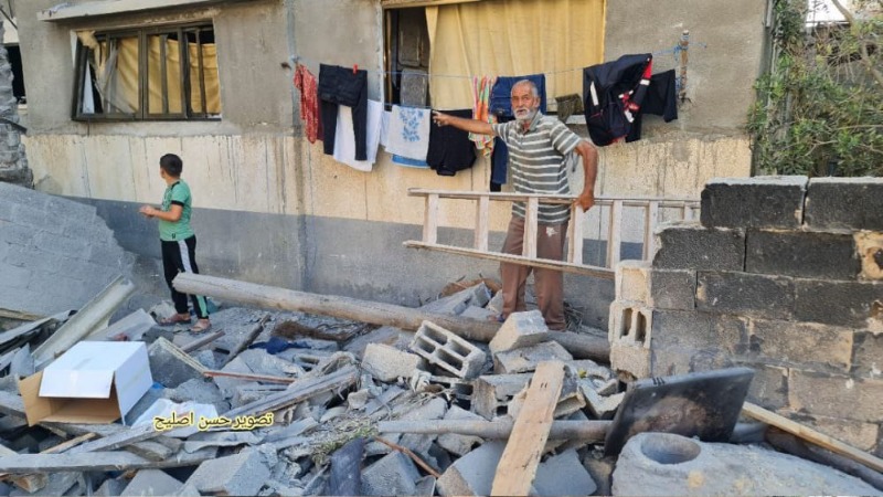 بالصور: مواطنون يتفقدون آثار عدوان"الاحتلال الإسرائيلي" على قطاع غزة